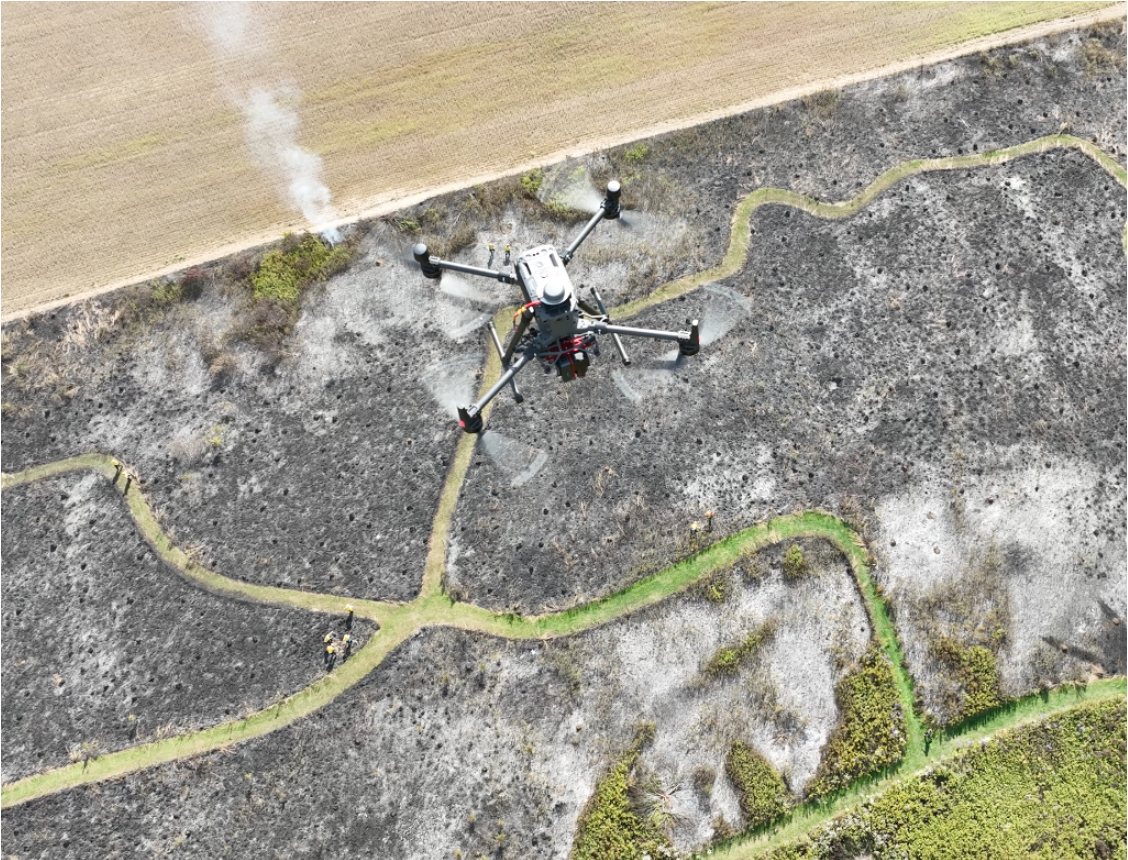 Drone monitoring a forest burn